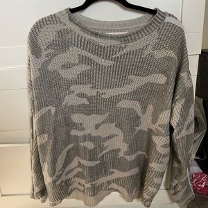 vintage havana long sleeve sweater. two stripes going down arms on both sides.